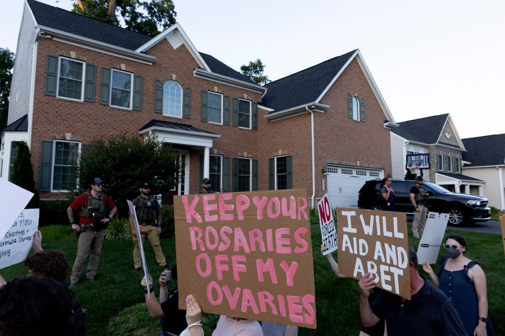 Abortion rights activists march near the home of conservative Supreme Court Justice Amy Coney Barrett,